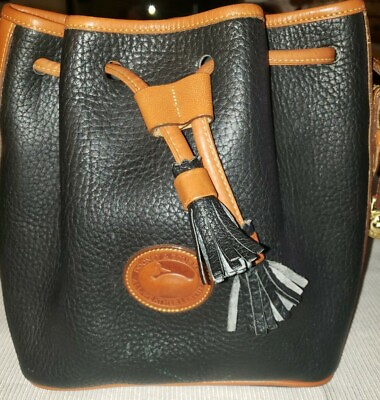 Dooney and bourke all weather leather bucket bag small. Please see photos. $69.99