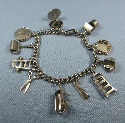 #ad Silver Tone Charm Bracelet 11 charms 7 inch