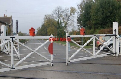 #ad PHOTO LEVEL CROSSING GATES CLOSING WANSFORD STATION LOOKING AS THE CROSSING GAT